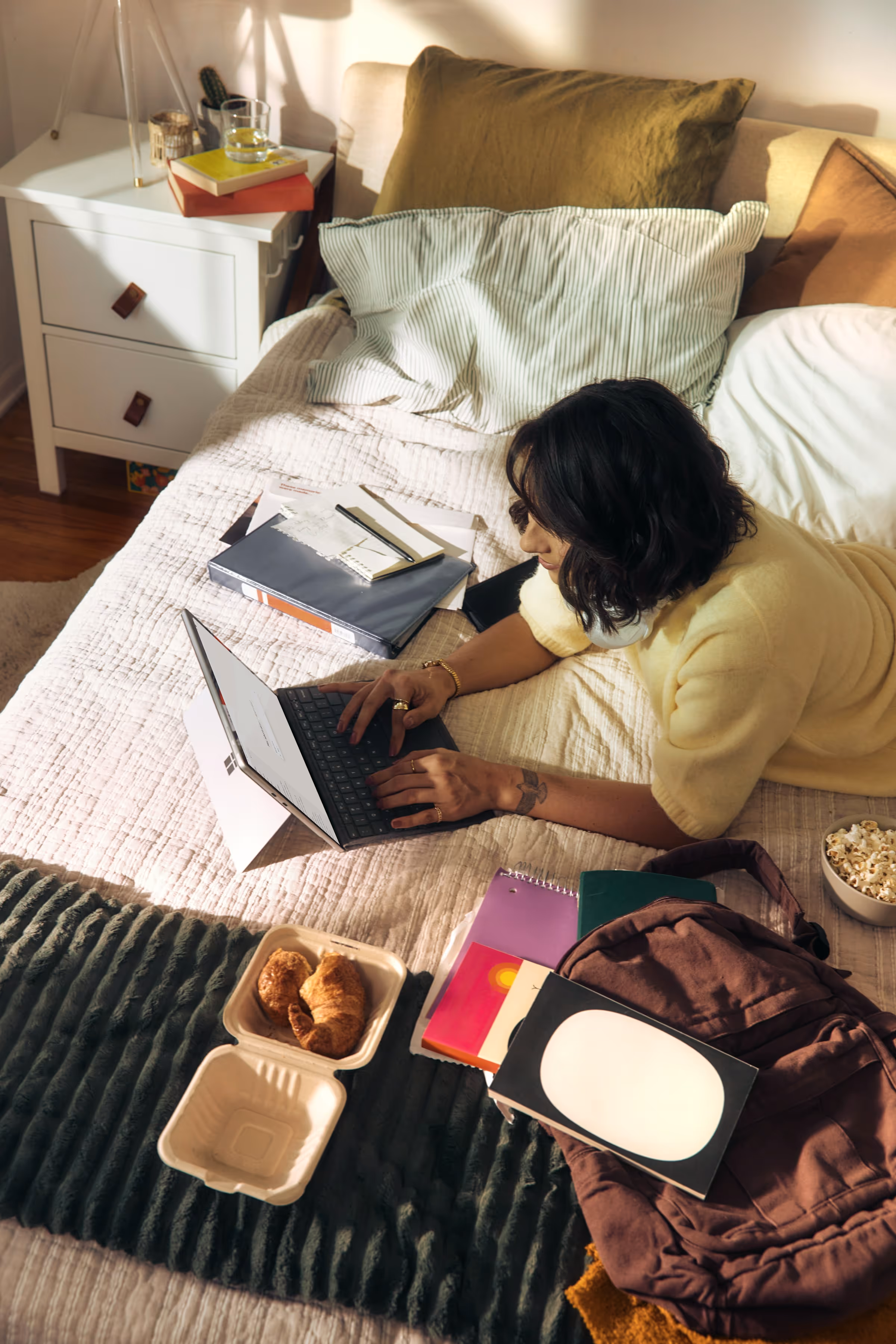 A solopreneur working on a laptop in a home workspace